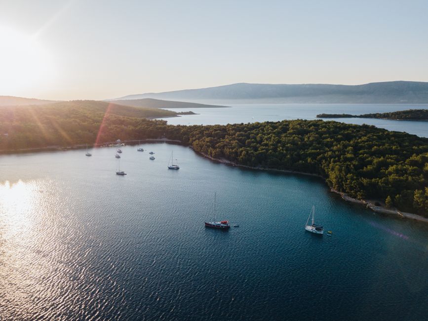 Stunning aerial view of yachts anchored in picturesque Vrboska Bay, Croatia at sunset.